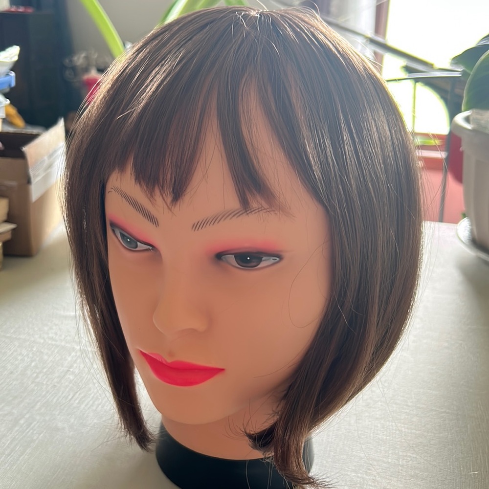 New still in box it came with Reddish synthetic wig.